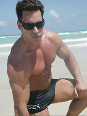 Sexy guys poses on beach and in hotel room