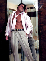 Hunky Marcello takes off his suit and plays with his huge cock