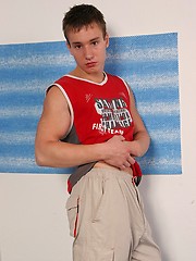 Athletic teen boy undress his shirt and pants