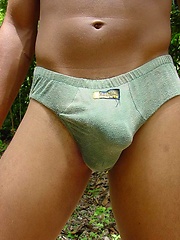 Handsome latin twink strips and poses outdoors