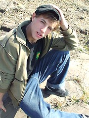 Handsome twink guy posing for the camera outdoors
