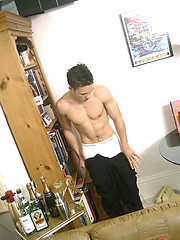 Twink grabs his crotch and poses for the camera