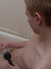 Foxxx - yummy blond lad poses in shower in white see-through briefs and wanks off