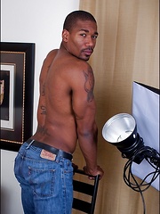 Ebony dad lays back on the couch and plays with his thick dick