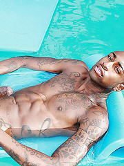 Rob takes a plunge at the swimming pool bare naked and unleashes his big black cock