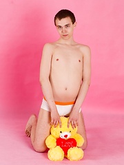 Straight guy Timmy Wright exposes his body with teddy in hands