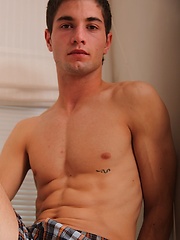 Louis exposes his chiseled abs while stroking his cock.