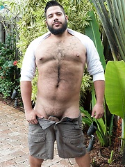 Bear shows off his burly chest and uncut dick as he gets naked to play outdoors